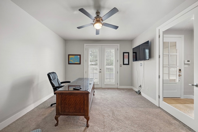 office featuring carpet, baseboards, a ceiling fan, and french doors