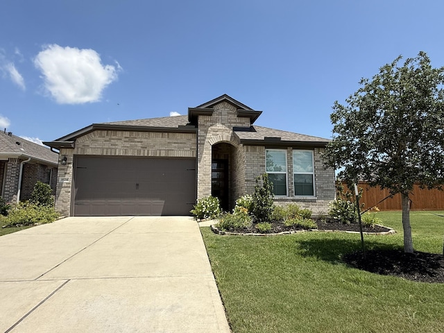 18714 Sweetwater Springs Dr, Cypress, TX 77433 - view of front facade with driveway, brick siding, an attached garage, and a shingled roof