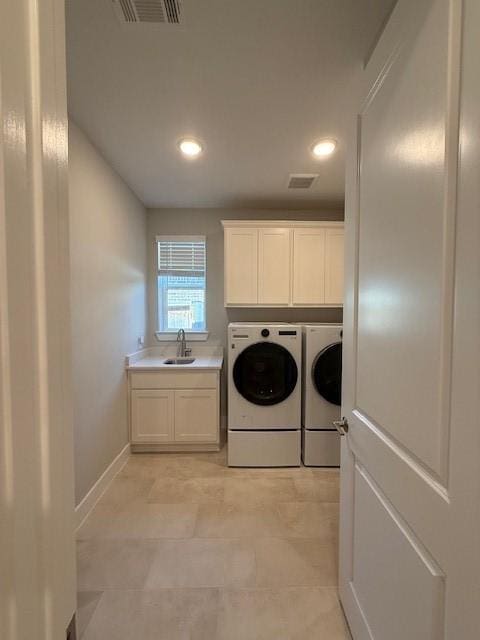 18714 Sweetwater Springs Dr, Cypress, TX 77433 - washroom featuring washer and clothes dryer, cabinet space, baseboards, light tile patterned floors, and recessed lighting