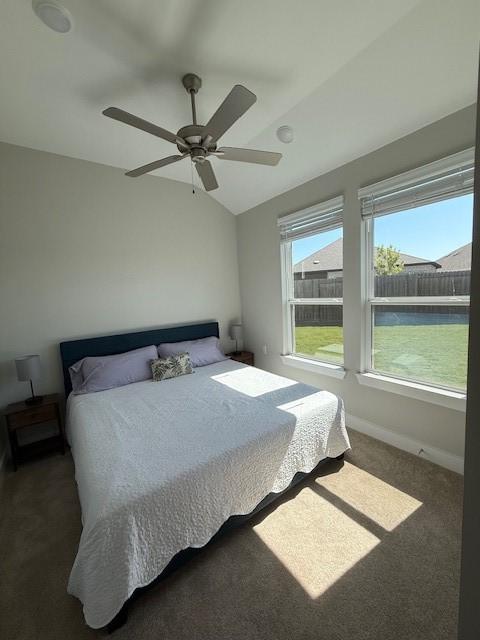 18714 Sweetwater Springs Dr, Cypress, TX 77433 - bedroom with carpet flooring, ceiling fan, lofted ceiling, and baseboards