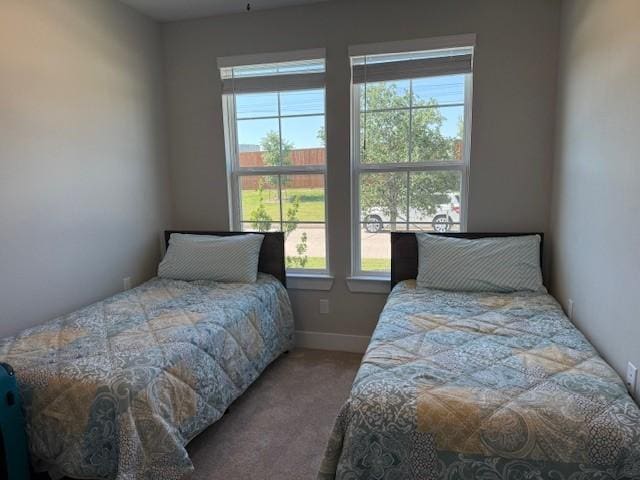 18714 Sweetwater Springs Dr, Cypress, TX 77433 - carpeted bedroom featuring multiple windows and baseboards