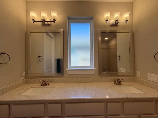 18714 Sweetwater Springs Dr, Cypress, TX 77433 - full bathroom with a shower with door and double vanity
