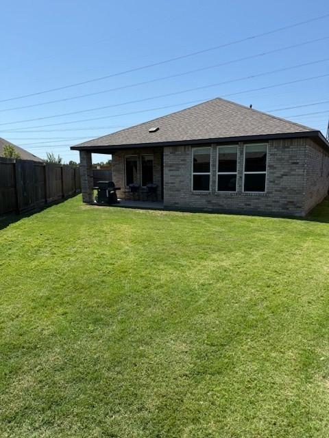 18714 Sweetwater Springs Dr, Cypress, TX 77433 - back of property with a shingled roof and brick siding