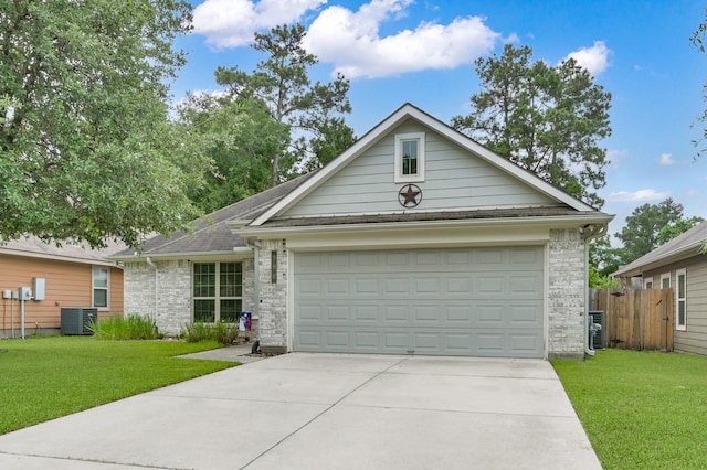 ranch-style house featuring central AC unit, driveway, an attached garage, and brick siding
