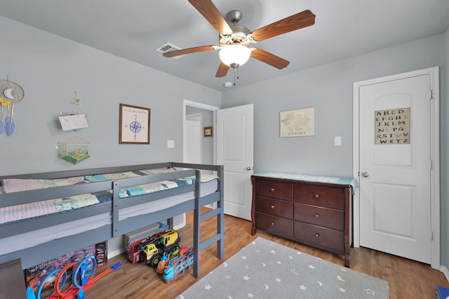 bedroom featuring wood finished floors and ceiling fan