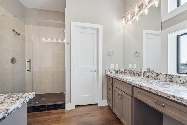 3104 Eunice St, Houston, TX 77009 - full bathroom featuring a stall shower, vanity, and wood finished floors