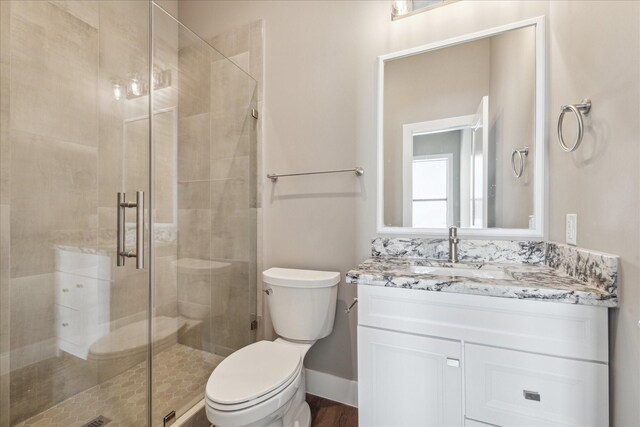 3104 Eunice St, Houston, TX 77009 - bathroom featuring toilet, a stall shower, and vanity
