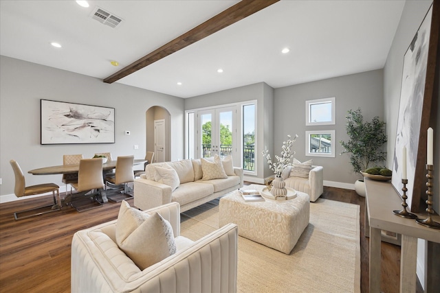 3104 Eunice St, Houston, TX 77009 - living room with arched walkways, wood finished floors, recessed lighting, beam ceiling, and baseboards