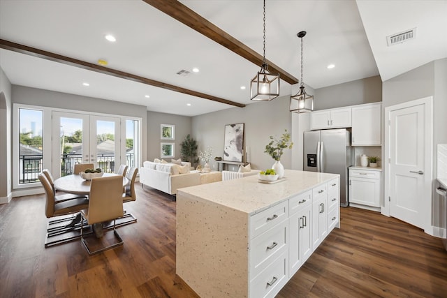 3104 Eunice St, Houston, TX 77009 - kitchen featuring stainless steel refrigerator with ice dispenser, beamed ceiling, dark wood-type flooring, white cabinetry, and recessed lighting