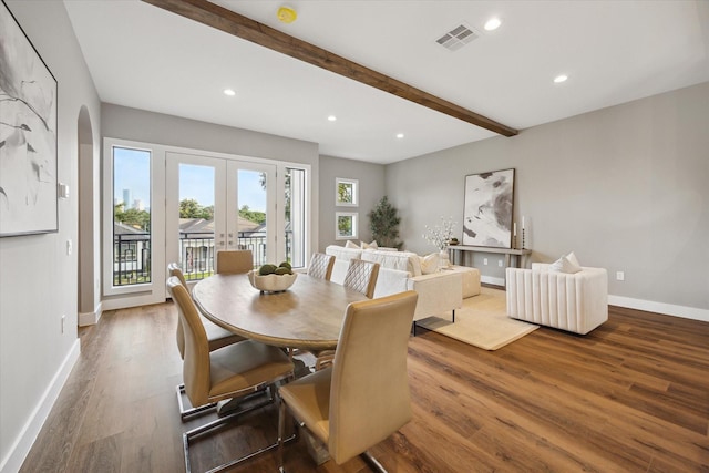 3104 Eunice St, Houston, TX 77009 - dining area featuring healthy amount of natural light, beam ceiling, wood finished floors, recessed lighting, and baseboards