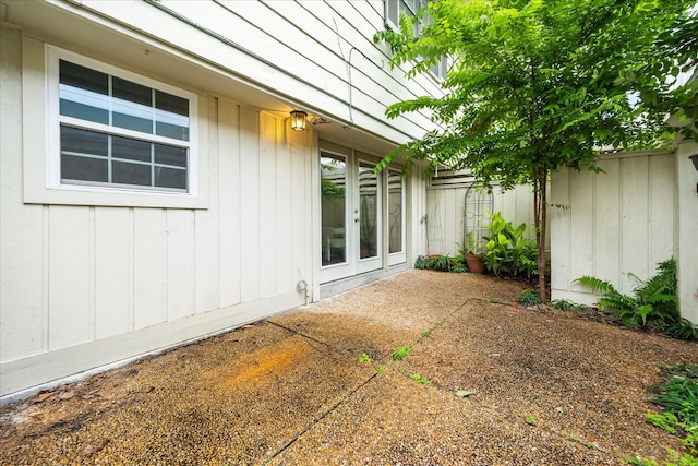 12709 Huntingwick Dr Unit 167, Houston, TX 77024 - view of patio featuring fence and french doors