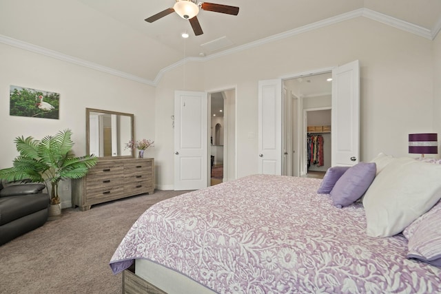 23440 Yaupon Hills Dr, New Caney, TX 77357 - carpeted bedroom with vaulted ceiling, crown molding, ceiling fan, baseboards, and a walk in closet