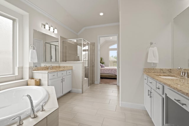 23440 Yaupon Hills Dr, New Caney, TX 77357 - ensuite bathroom with a shower stall, crown molding, two vanities, a garden tub, and baseboards
