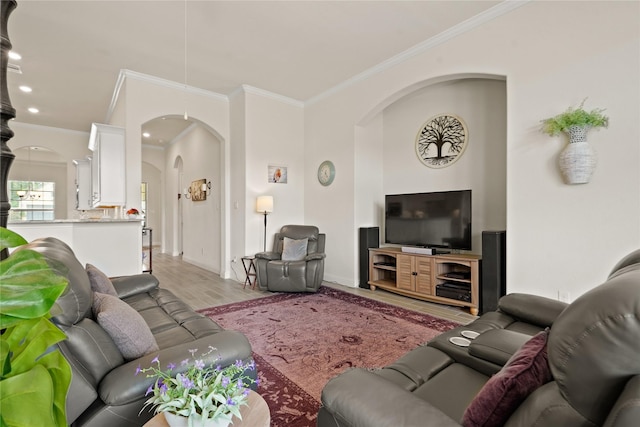 23440 Yaupon Hills Dr, New Caney, TX 77357 - living room with arched walkways, crown molding, light wood-style flooring, and baseboards