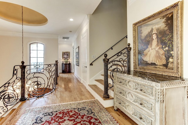 256 S Post Oak Ln, Houston, TX 77056 - foyer entrance with light wood-style floors, ornamental molding, baseboards, and stairway