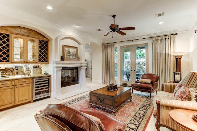 256 S Post Oak Ln, Houston, TX 77056 - living area featuring wine cooler, ornamental molding, ceiling fan, french doors, and recessed lighting