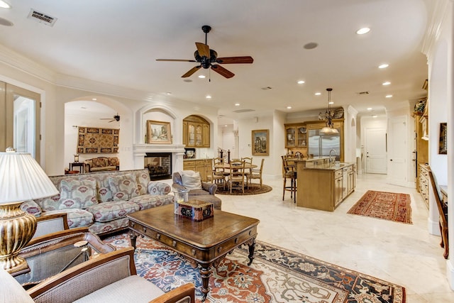 256 S Post Oak Ln, Houston, TX 77056 - living area featuring ceiling fan, ornamental molding, recessed lighting, arched walkways, and a multi sided fireplace