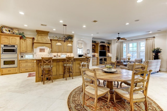 256 S Post Oak Ln, Houston, TX 77056 - dining space with crown molding, ceiling fan, recessed lighting, arched walkways, and light tile patterned flooring