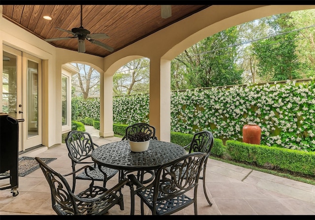 256 S Post Oak Ln, Houston, TX 77056 - view of patio with ceiling fan, outdoor dining space, and fence