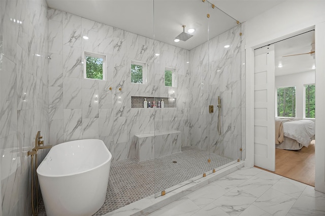 7321 Ponderosa Dr, Magnolia, TX 77354 - bathroom with a soaking tub, ensuite bathroom, a marble finish shower, and marble finish flooring