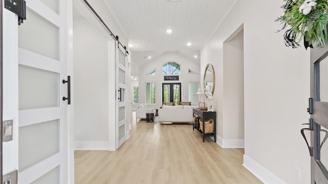 7321 Ponderosa Dr, Magnolia, TX 77354 - entrance foyer featuring french doors, light wood-type flooring, a barn door, recessed lighting, and lofted ceiling