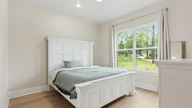 7321 Ponderosa Dr, Magnolia, TX 77354 - bedroom with multiple windows, light wood-style flooring, and baseboards