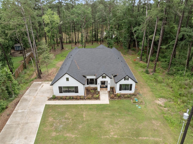 7321 Ponderosa Dr, Magnolia, TX 77354 - view of front of property with concrete driveway and a shingled roof