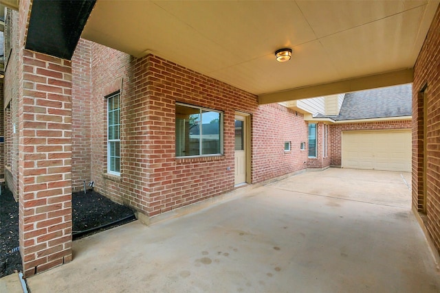 9619 Silver Birch Ct, Missouri City, TX 77459 - view of patio featuring concrete driveway and a garage