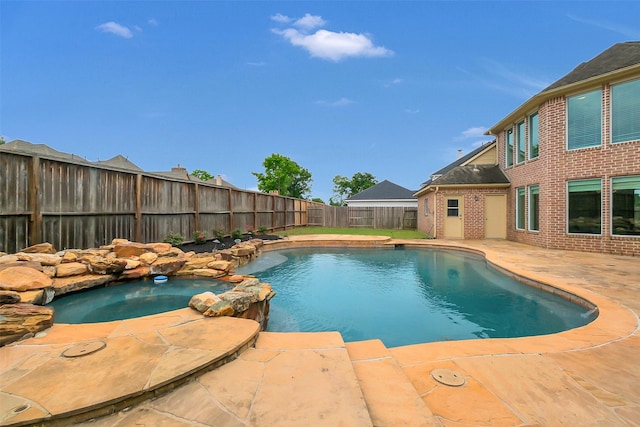 9619 Silver Birch Ct, Missouri City, TX 77459 - view of pool with a fenced backyard, a patio, and a pool with connected hot tub