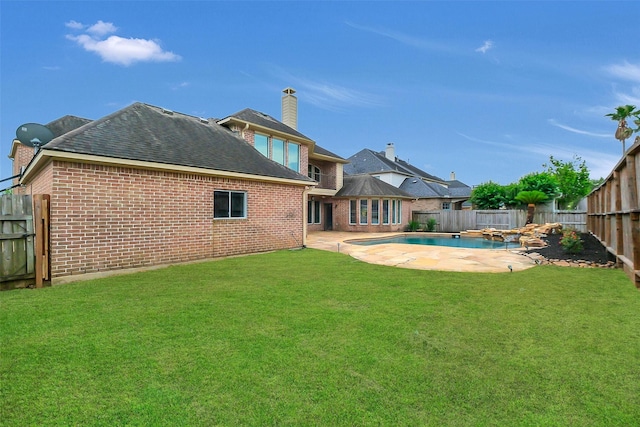 9619 Silver Birch Ct, Missouri City, TX 77459 - rear view of property featuring brick siding, a shingled roof, a chimney, and a patio