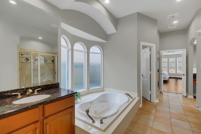 9619 Silver Birch Ct, Missouri City, TX 77459 - bathroom with a shower stall, vanity, a whirlpool tub, tile patterned floors, and recessed lighting