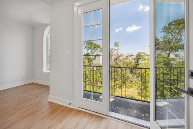 1037 17th St, Houston, TX 77008 - doorway with baseboards, wood finished floors, and arched walkways