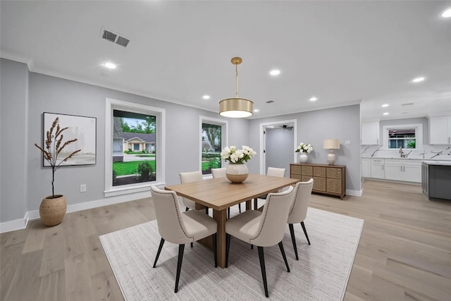 1122 Lehman St, Houston, TX 77018 - dining room featuring healthy amount of natural light, light wood-style floors, recessed lighting, and baseboards