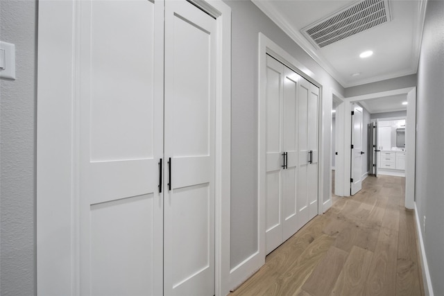 1122 Lehman St, Houston, TX 77018 - corridor featuring crown molding, light wood-style floors, baseboards, and recessed lighting