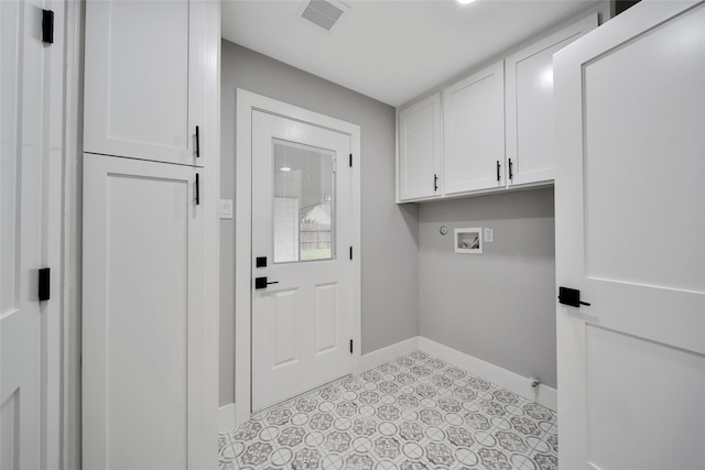 1122 Lehman St, Houston, TX 77018 - clothes washing area featuring washer hookup, cabinet space, baseboards, and light floors