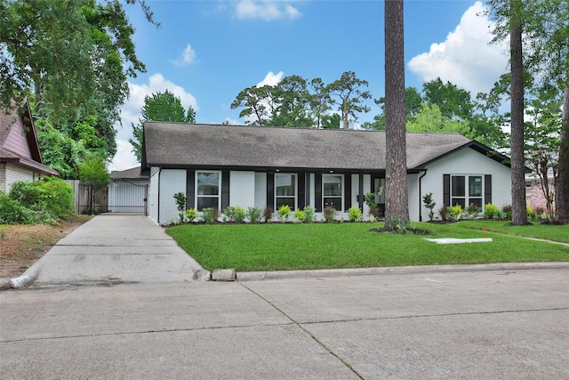 1122 Lehman St, Houston, TX 77018 - view of front of property featuring a gate, a front yard, brick siding, and roof with shingles