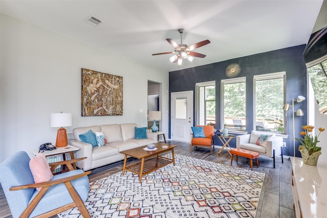 342 Topper Pines Dr, Montgomery, TX 77316 - living area with wood finished floors, ceiling fan, and baseboards