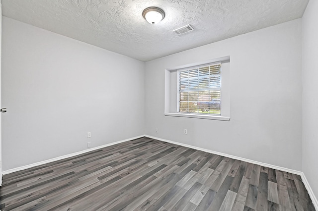 4126 Fitzwater Dr, Spring, TX 77373 - spare room with dark wood finished floors, baseboards, and a textured ceiling