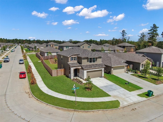 109 Chestnut Gate Dr, Conroe, TX 77378 - traditional-style house featuring a residential view, driveway, a garage, roof with shingles, and stone siding