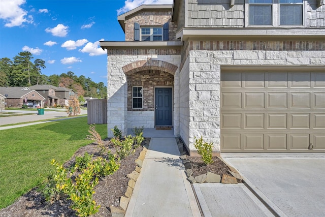 109 Chestnut Gate Dr, Conroe, TX 77378 - property entrance with stone siding, a lawn, and a garage