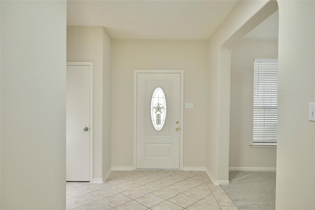 23902 Spring Way Dr, Spring, TX 77373 - entrance foyer with light tile patterned floors, arched walkways, and baseboards