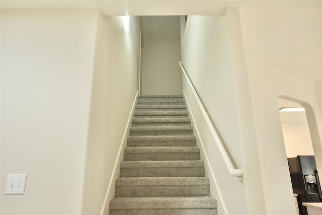 23902 Spring Way Dr, Spring, TX 77373 - staircase featuring baseboards and arched walkways