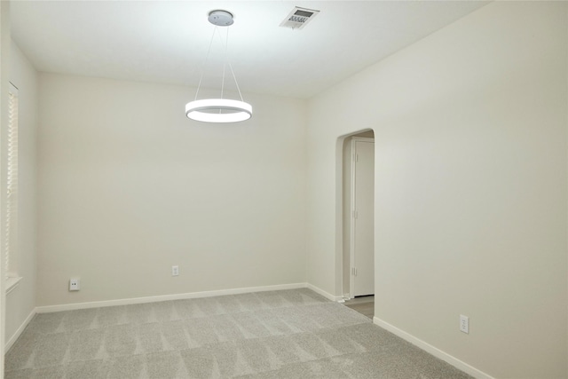 23902 Spring Way Dr, Spring, TX 77373 - spare room with arched walkways, light colored carpet, and baseboards
