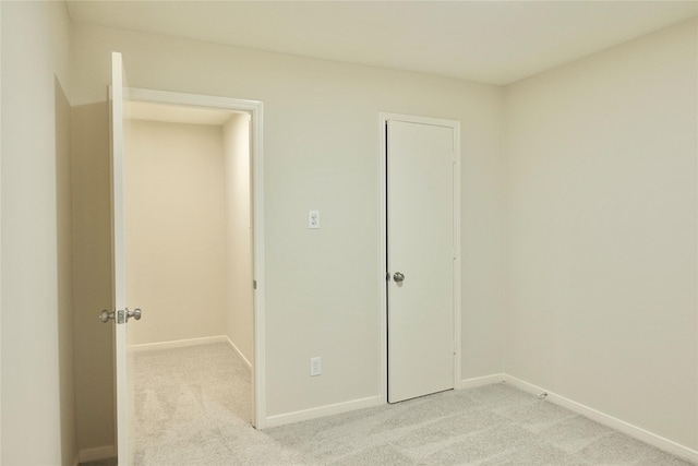 23902 Spring Way Dr, Spring, TX 77373 - unfurnished bedroom with light colored carpet and baseboards