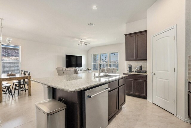 23719 Scotsman Dr, Katy, TX 77493 - kitchen featuring a sink, dishwasher, ceiling fan, an island with sink, and dark brown cabinets