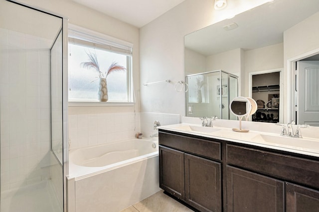 23719 Scotsman Dr, Katy, TX 77493 - bathroom with a stall shower, a garden tub, a walk in closet, double vanity, and tile patterned floors