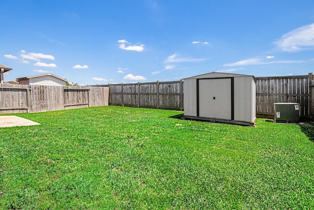 23719 Scotsman Dr, Katy, TX 77493 - view of yard featuring a storage unit and an outbuilding