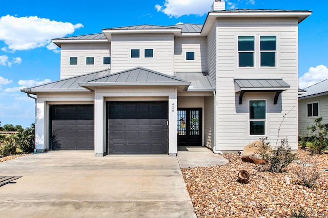 428 Bay Club Dr, Seadrift, TX 77983 - view of front of property featuring a standing seam roof, driveway, and french doors