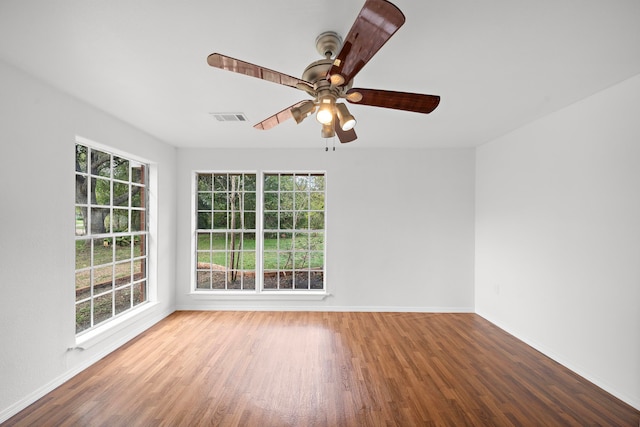 115 Old Caney Rd, Wharton, TX 77488 - unfurnished room featuring wood finished floors, baseboards, and a ceiling fan