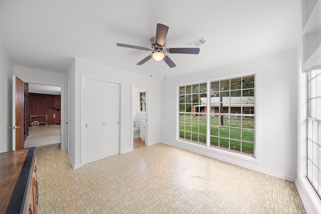 115 Old Caney Rd, Wharton, TX 77488 - unfurnished bedroom featuring a closet, baseboards, and a ceiling fan